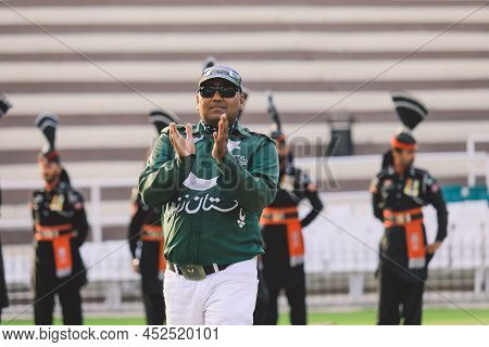 Wagah Border, Pakistan - July 22, 2021: Brave Pakistan Soldiers In Bright Military Uniform Marching 