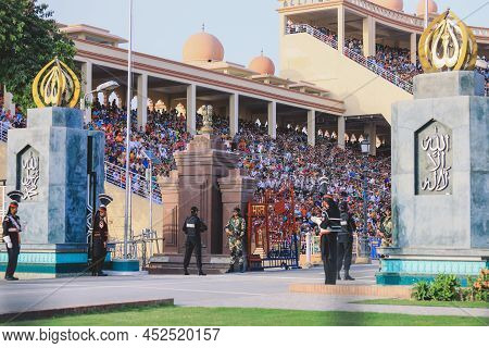 Wagah Border, Pakistan - July 22, 2021: Brave Pakistan Soldiers In Bright Military Uniform Marching 