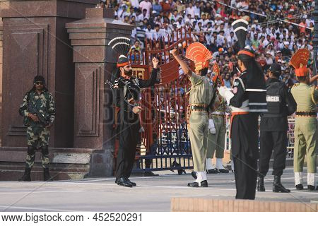 Wagah Border, Pakistan - July 22, 2021: Brave Pakistan Soldiers In Bright Military Uniform Marching 