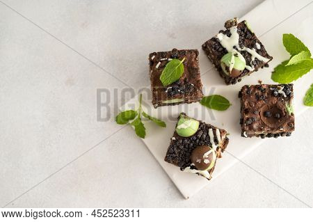 Bite Sized Chocolate And Mint Dessert, Bite Sized Sweet Cake Desserts, Top View, Copy Space.