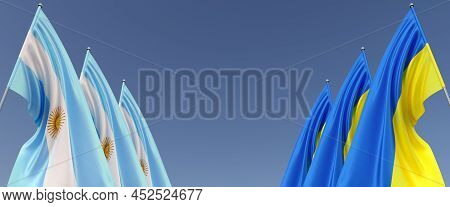 Flags Of Argentina And Ukraine On Flagpoles On Sides. Flags On A Blue Background. Place For Text. In