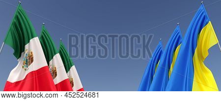 Flags Of Mexico And Ukraine On Flagpoles On Sides. Flags On Blue Background. Place For Text. Indepen