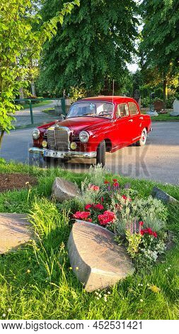 Velbert, Nrw, Germany - June 14, 2021:
A Red Mid-size Luxury Car Mercedes-benz 180 (w120), 1955.
