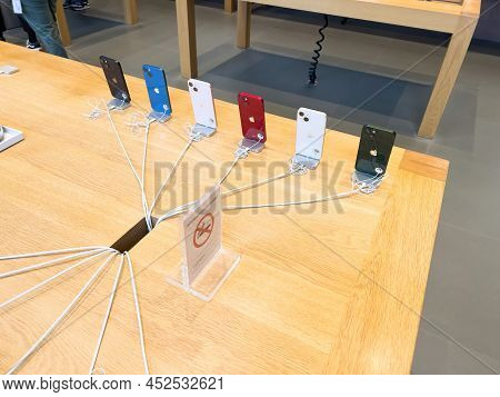 Paris, France - Ap 7, 2022: Rear View Of Full Range Of Apple Computers Iphone Smartphones With Secur