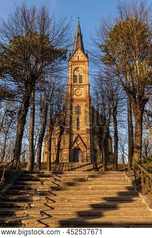 Torņakalns Church In Riga, Latvia, Europe During Early Spring Evening. Neo-gothic Yellow Stone Luthe