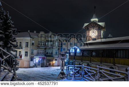 Detailed View Of An Ancient Wooden Town Hall With An Antique Clock. Famous Tourist Place And A Place