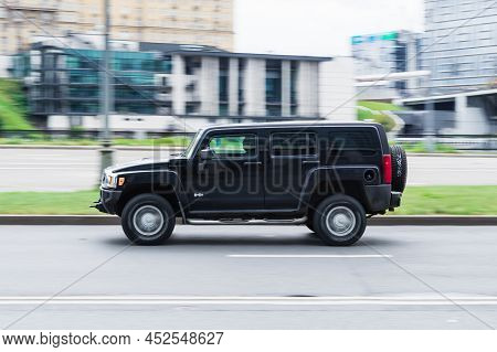 Hummer H3 Suv Vehicle On The City Road. Fast Moving Black Car On Moscow Streets. Accelerating With L