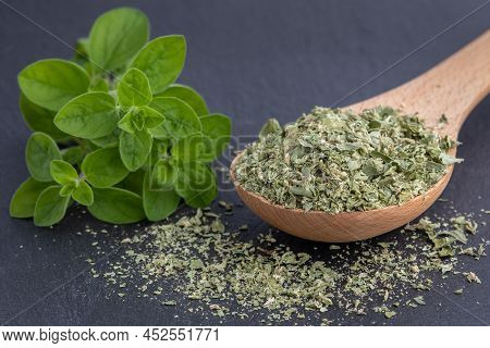 Dried Marjoram Or Oregano On A Black Background, Fresh Marjoram O Oregano Leaves,