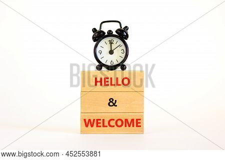Hello And Welcome Symbol. Concept Words Hello And Welcome On Wooden Blocks. Beautiful White Backgrou