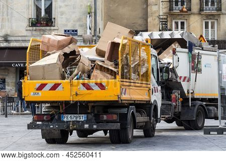 Bordeaux, France - February 19, 2022: Garbage Truck With Specialized In Recycling Cardboard In A Was