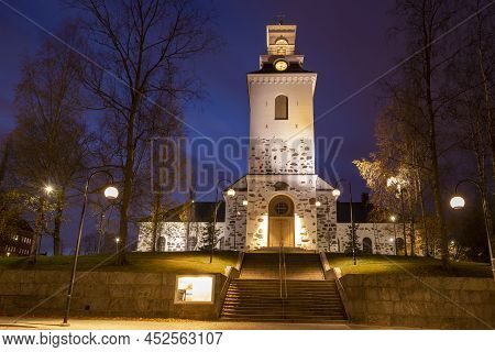 Old Lutheran Cathedral Of Kuopio City In Night Autumn Landscape. Finland