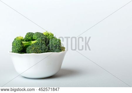 Broccoli Of Fresh Green Broccoli In Bowl Over Coloredbackground. , Close Up. Fresh Vegetable.