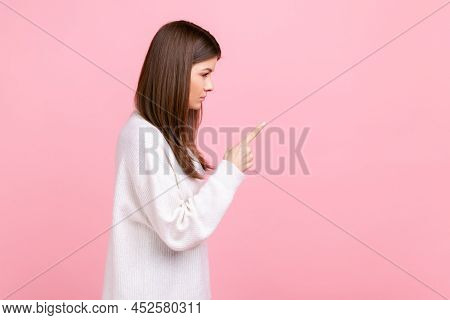 Side View Portrait Of Strict Female With Raised Finger, Showing Warning Gesture, Scolding Somebody, 