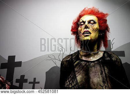 Red Hair Zombie With Neck Chain In Graveyard