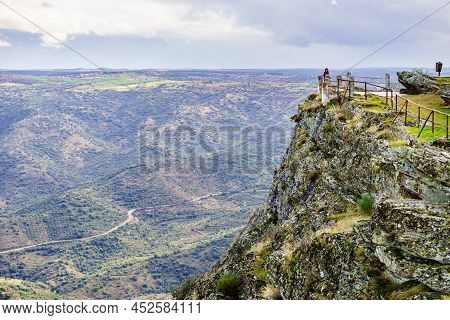 Border Between Portugal And Spain. Tourist Woman At Penedo Durao Lookout. Mountain Landscape. Nation