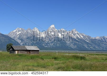 Field With Teton Mountains In The Background