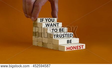 Be Honest Symbol. Wooden Blocks With Words 'if You Want To Be Trusted Be Honest'. Businessman Hand. 