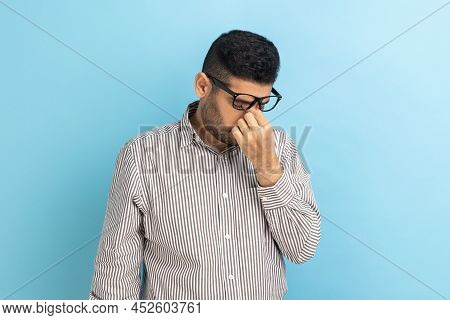 Portrait Of Frustrated Businessman In Eyeglasses Rubbing His Eyes, Being Tired Of Long Hours Working