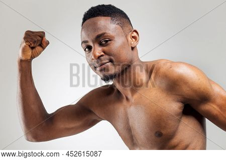 Running Blac Man Over The Light Background With Persistent Look