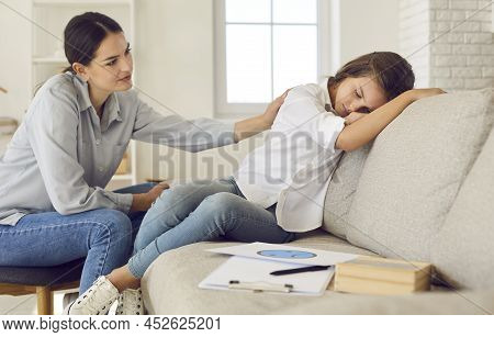 Therapist Or Psychologist Helping Sad Child Cope With Stress, Depression And Other Problems