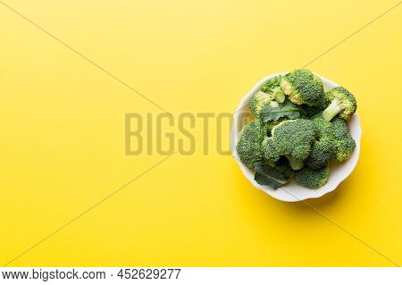 Broccoli Of Fresh Green Broccoli In Bowl Over Coloredbackground. , Close Up. Fresh Vegetable.