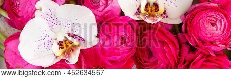 Flowers Composition. Floral Natural Background Made Of Pink Rununculus And Orchid Fresh Flowers.