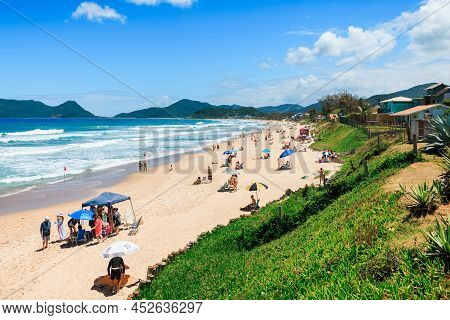 January 8, 2022. Florianopolis, Brazil. Holiday Beach With People And Blue Ocean With Waves In Brazi