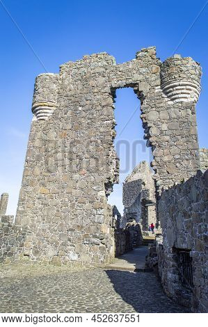 Bushmills, Northern Ireland, March 18, 2022. Front View Of Dunluce Castle Gate House In A Sunny Day.