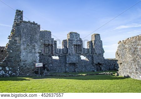 Bushmills, Northern Ireland, March 18, 2022. Dunluce Castle Ruins At Northern Ireland In A Sunny Day