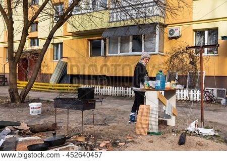 Bucha, Ukraine - Apr. 06, 2022: Local Residents Of Bucha From Apartments And Houses Destroyed By The