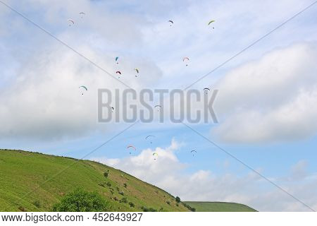 Paragliders Flying Above The Ridge At Pandy, Wales
