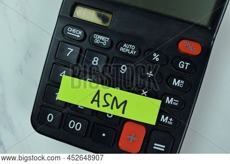 Asm And Calculator Write On Sticky Notes Isolated On Wooden Table.