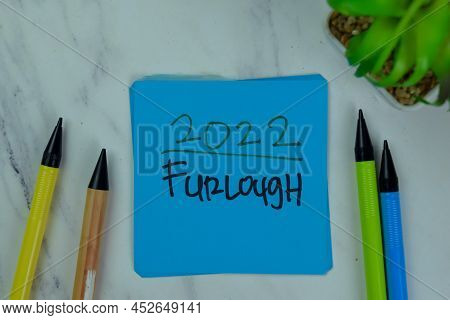 2022 Furlough Write On Sticky Notes Isolated On Wooden Table.