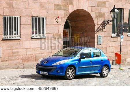 Nuremberg, Germany - September 9, 2019: Blue Compact Car Peugeot 206+ In A City Street.
