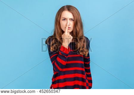 You Are Liar. Portrait Of Angry Woman Wearing Striped Casual Style Sweater Standing And Looking At C