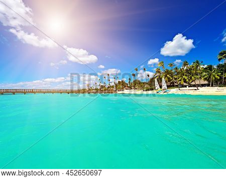 Beautiful Caribbean Beach In Dominican Republic. Tropical Idyllic Summer Landscape With Sea And Blue