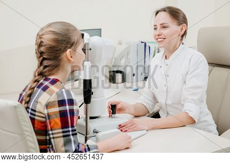 Ophthalmologist Examines The Girl On A Corneo Topographer. Modern Clinic.