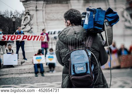Lisbon, Portugal - February 24, 2022: True Tilt-shift Shot With Selective Focus On A Tv Operator Wit