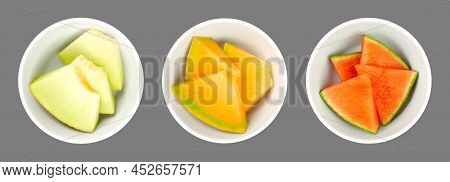 Melon Slices, In White Bowls, Over Gray. Galia, Honey Cantaloupe Melon And Watermelon. Freshly Cut, 