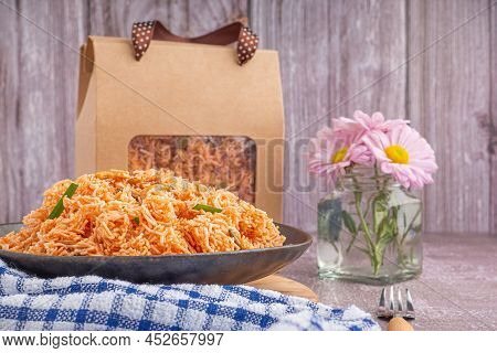Sweet And Sour Crispy Noodles Or Mee Krob In The Thai Language On A Dish With Cloth, Vase Placed On 