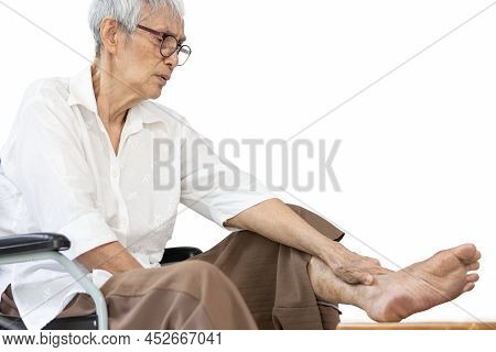 Asian Senior Woman Massaging Ankle And Feet,old Elderly Had Beriberi,cramp,numbness In Her Feet,sore
