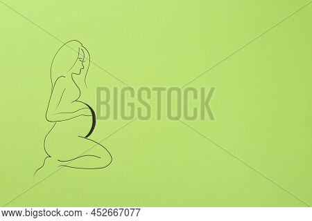 Pregnant Woman Figure Drawn On Light Green Background, Top View With Space For Text. Surrogacy Conce