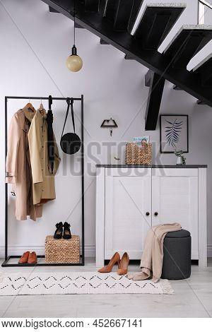 Modern Hallway Interior With Stylish Furniture And Key Holder