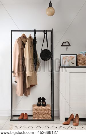 Modern Hallway Interior With Stylish Furniture And Key Holder