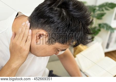 Asian Middle-aged Man Suffering From Scruff Pain,occipital Bone,stiffness Neck And Shoulders Injury,