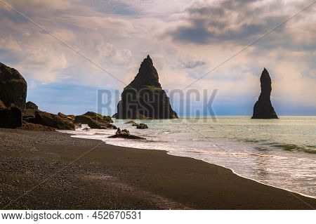 Reynisdrangar Basalt Sea Stacks Situated Under The Mountain Reynisfjall Near The Village Vik In Sout