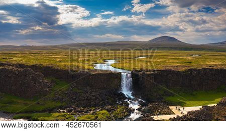 Aerial View Of The Oxarafoss Waterfall With Tourists In Iceland. Oxarafoss Also Called Oxararfoss Is