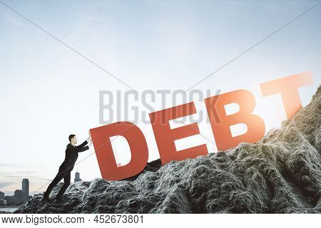 Abstract Image Of Businessman Pushing Debt Burden On Mountain. Bright Sky Background. Mock Up Place.