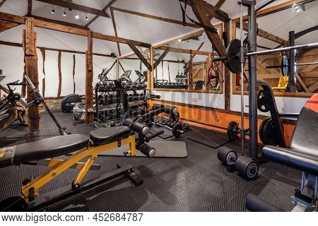 Fen Drayton, England - June 7 2018: Home Gym Within Converted Outbuilding Furnished With Weights And