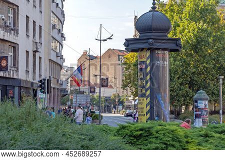 Belgrade, Serbia - September 06, 2021: Retro Style Rotating Advertisement Column In City Centre.